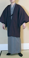 A 'haori' is worn over the yukata or tanzen. It is short in length, and has rather large sleeve-pockets to allow the sleeves of your yukata or tanzen to fit in easily and your arms to move smoothly. This haori also serves as a coat. The tabi are Japanese-style socks.